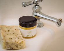 Image of Rose Petals Day Cream by Willow & Birch Apothecary beside a handmade soap on a bathroom sink, embodying best face moisturizer for dry skin and the top selection of natural face moisturizers.