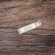 Cocoa Mint natural lip balm from Willow & Birch Apothecary, positioned on a rustic wooden texture, an ideal chapstick for daily use and the best lip moisturizer for chapped lips.