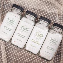 Assorted Willow and Birch Apothecary all natural bath salts including English Fog, Lemon Zen, Lavender Breeze, and Orange Spice, arranged on a textured fabric, perfect for a therapeutic salts and spa bath salts experience.