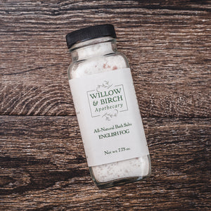 Discover the natural Dead Sea salts with Willow and Birch Apothecary’s English Fog epson salt bath blend, shown on a rustic wooden backdrop. These best bath salts for relaxing are infused with Epsom salt, offering multiple epsom salt uses including soothing sore muscles and promoting tranquility.