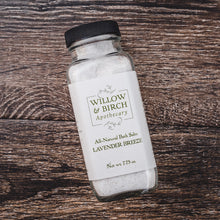 Indulge in the best bath salts with Willow & Birch Apothecary’s Lavender Breeze Epsom salt bath blend, shown on a textured wooden surface. These spa bath salts are not just good bath salts, they’re the best, blending natural ingredients for a deeply soothing and aromatic bath experience.