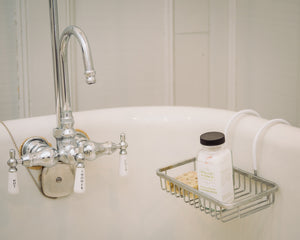 Natural epsom bath salts and scented soap by Willow & Birch Apothecary on antique clawfoot bath tub