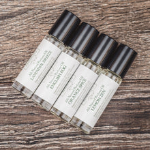 Top view of all natural perfume oils by Willow and Birch Apothecary featuring fragrances like Lavender Breeze, English Fog, Lemon Zen, and Orange Spice, embodying luxury oil fragrance.